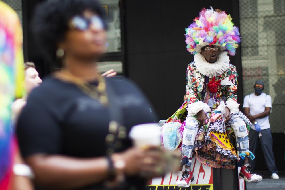 People watch a free outdoor event organized by The Broadway League during Juneteenth celebrations at Times Square on Saturday, June 19, 2021, in New York. Parades, picnics and lessons in history marked Juneteenth celebrations in the U.S., a day that marks the arrival of news to enslaved Black people in a Texas town that the Confederacy had surrendered in 1865 and they were free. (AP Photo/Eduardo Munoz Alvarez)