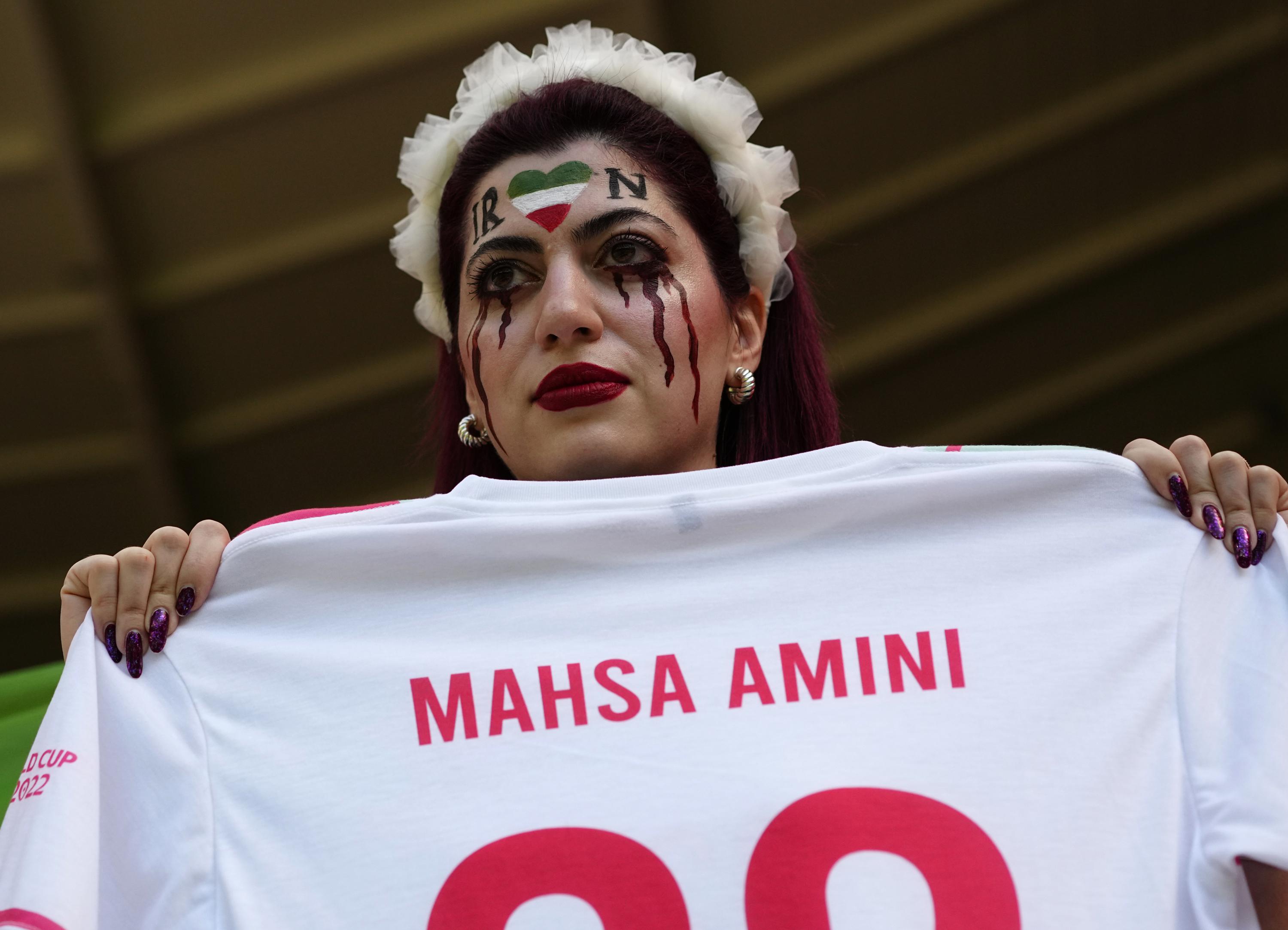 Iran regime supporters confront protesters at World Cup game