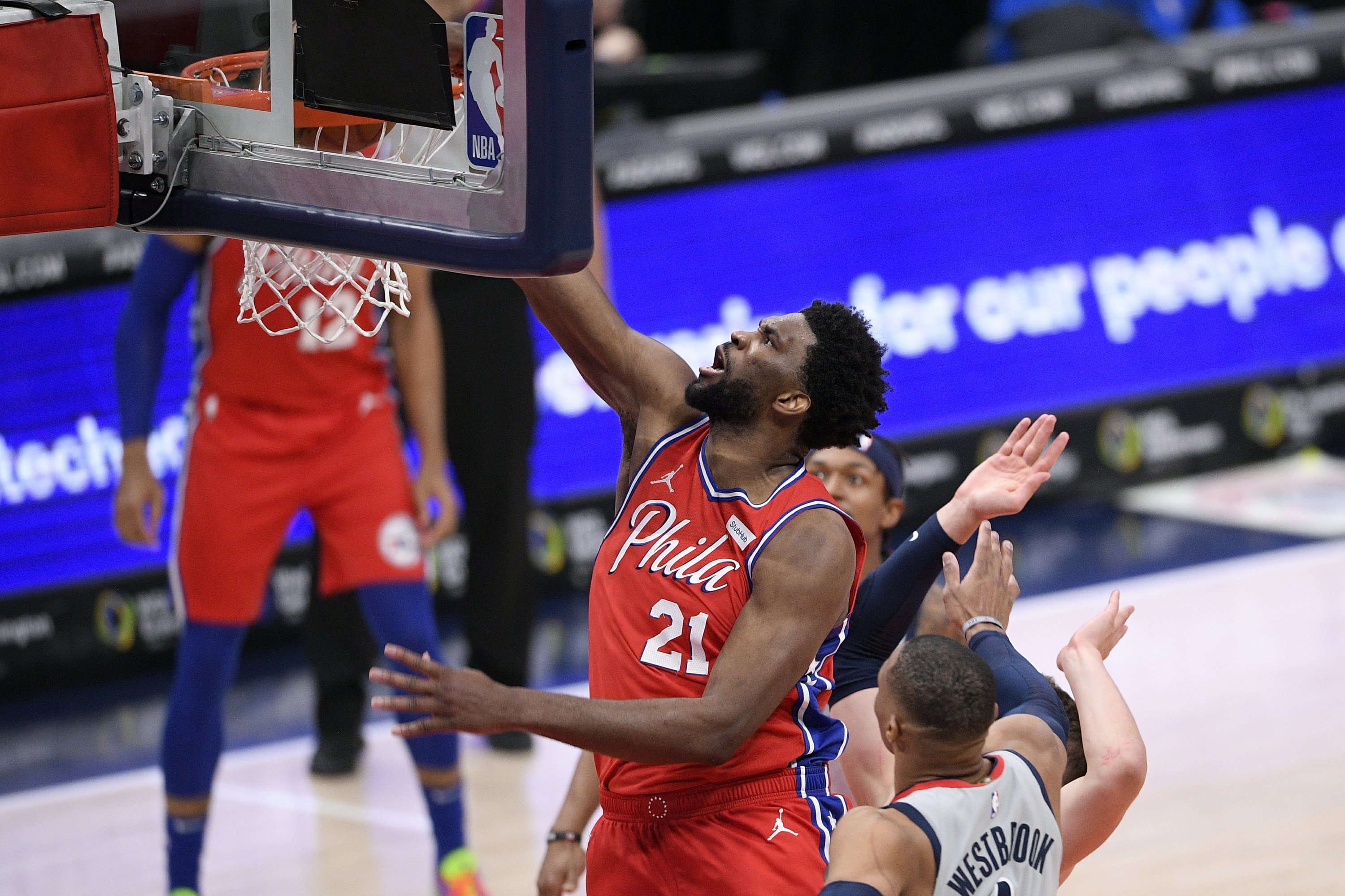 Embiid exits with apparent leg injury, 76ers beat Wizards AP News