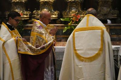 A celebrating priest leads a Latin Mass at Rome's ancient Pantheon basilica, in Rome, Italy, Friday, Oct. 29, 2021. Traditionalist Catholics descended on Rome on Friday for their annual pilgrimage, hoping to show the vibrancy of their community after Pope Francis issued a crackdown on the spread of the Latin Mass that many took as an attack on the ancient rite. An evening vespers service at Rome's ancient Pantheon basilica, the first event of the three-day pilgrimage, was so full that ushers had to add two rows of chairs to accommodate the faithful. Many young families, couples and priests filled the pews, hailing from the U.S., France, Spain and beyond. (AP Photo/Luca Bruno)