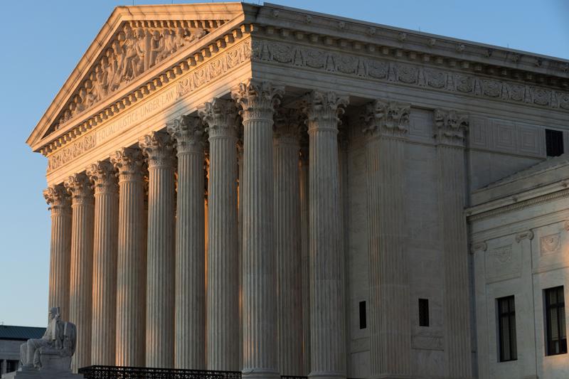 FILE - In this Aug. 2, 2021, file photo the U.S. Supreme Court is seen on Capitol Hill in Washington. President Joe Biden may have averted a flood of evictions and solved a growing political problem when his administration reinstated a temporary ban on evictions because of the COVID-19 crisis, but he left his lawyers with legal arguments that even he acknowledged might not stand up in court.  (AP Photo/Jose Luis Magana, File)