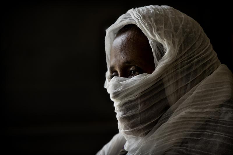 FILE - In this Friday, May 14, 2021 file photo, a 40-year-old woman who was says she was held captive and repeatedly raped by 15 Eritrean soldiers over a period of a week in a remote village near the Eritrea border, speaks during an interview at a hospital in Mekele, in the Tigray region of northern Ethiopia. A new Amnesty International report published Wednesday, Aug. 11, 2021 says dozens of women have described shocking sexual assaults by Ethiopian soldiers and allied forces in the country's Tigray conflict, and its researcher calls it striking how the perpetrators appeared to act without fear of punishment from their commanders. (AP Photo/Ben Curtis, File)