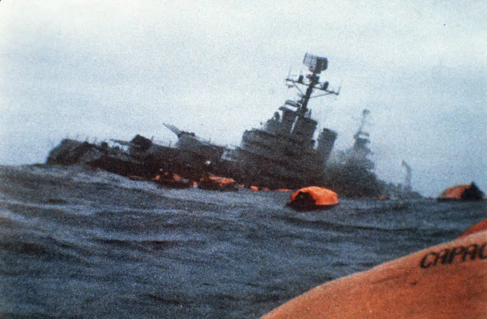 FILE - The Argentinian cruiser General Belgrano sinks amid orange life rafts holding survivors in the South Atlantic Ocean, May 1, 1982, after being torpedoed by the British Royal Navy. The government of Argentina informed Britain on Thursday, March 2, 2023, that it has ended a cooperation pact signed in 2016 between the two countries and called on London to talks to discuss the sovereignty of the Islands. (AP Photo, File) FILE - The Argentinian cruiser General Belgrano sinks amid orange life rafts holding survivors in the South Atlantic Ocean, May 1, 1982, after being torpedoed by the British Royal Navy. The government of Argentina informed Britain on Thursday, March 2, 2023, that it has ended a cooperation pact signed in 2016 between the two countries and called on London to talks to discuss the sovereignty of the Islands. (AP Photo, File)