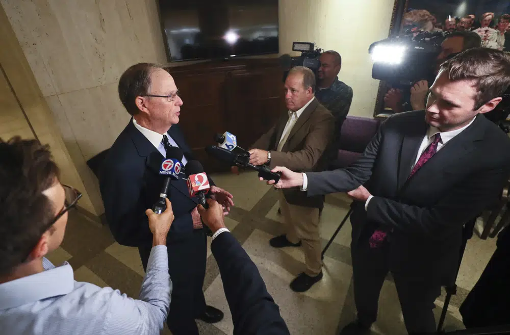 Locke Burt, Chairman and CEO of Security First Insurance in Ormond Beach, speaks to reporters Monday, Dec. 12, 2022, at the Capitol in Tallahassee, Fla. Burt served in the Florida Senate for 12 years, from 1991-2002. (AP Photo/Phil Sears)