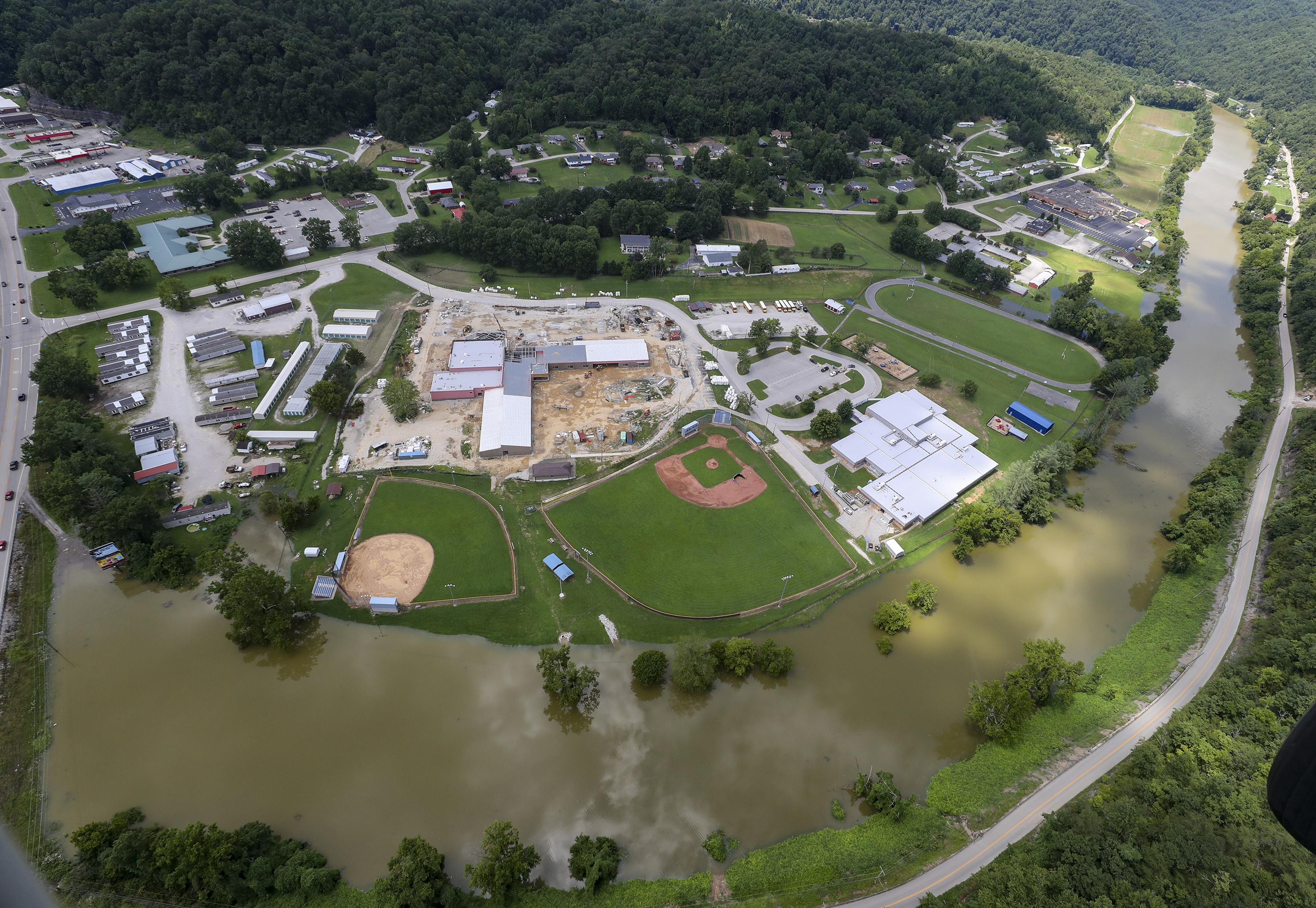 Extra rain, extra our bodies in flooded Kentucky mountain cities