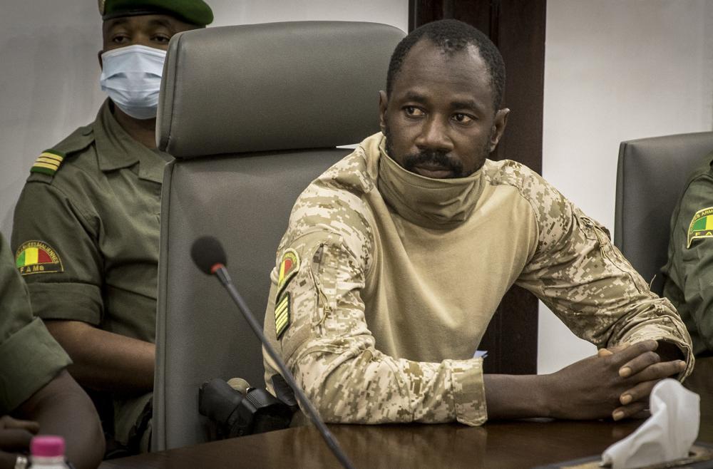 FILE - Col. Assimi Goita meets with a high-level delegation from the West African regional bloc known as ECOWAS, at the Ministry of Defense in Bamako, Mali on Aug. 22, 2020. Malian authorities have arrested suspects Tuesday May, 17, 2022, after an announcement by the ruling junta that it had foiled a coup attempt supported by an unnamed Western government. Security forces thwarted the countercoup against two-time coup leader Col. Assimi Goita, according to a government statement. (AP Photo, File)