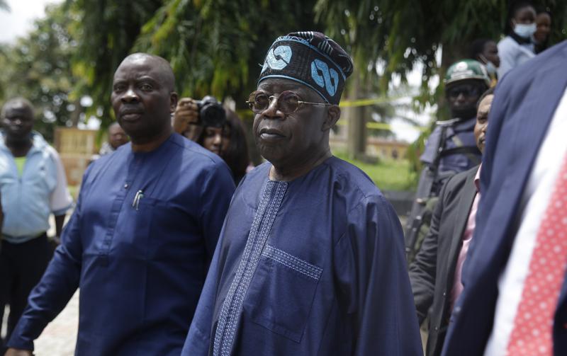 Bola Tinubu, centre , pays a visit at the St Francis Catholic Church following a gunmen attacked in Owo, Nigeria, Monday, June 6, 2022. A former governor of Lagos, Nigeria’s largest city, has been nominated to be the ruling party’s presidential candidate in next year’s presidential election. Bola Tinubu, widely referred to as the “godfather” of Lagos because of his influence in the southwestern state which he governed from 1999 to 2007, polled a majority of the votes on Wednesday at the convention of the All Progressives Congress party. (AP Photo/Sunday Alamba)