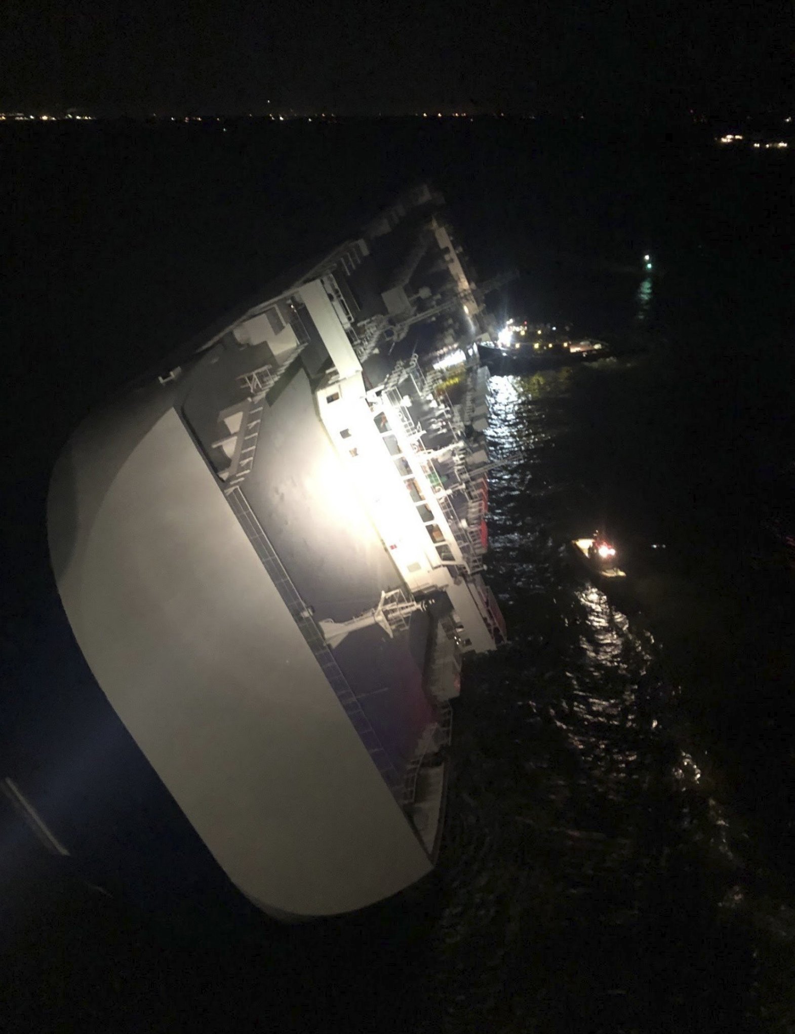 The Latest 4 missing after cargo ship overturns off AP News