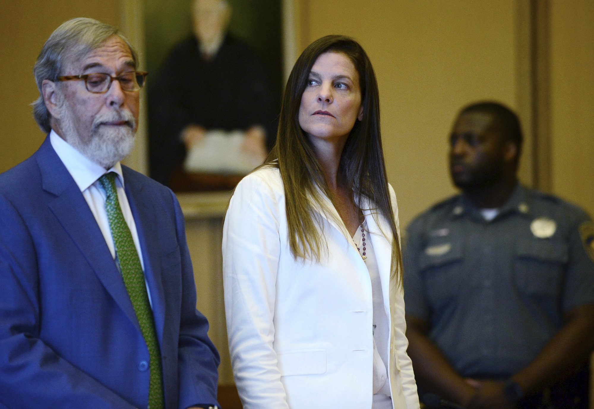 Woman charged in missing mom case makes court appearance | AP News