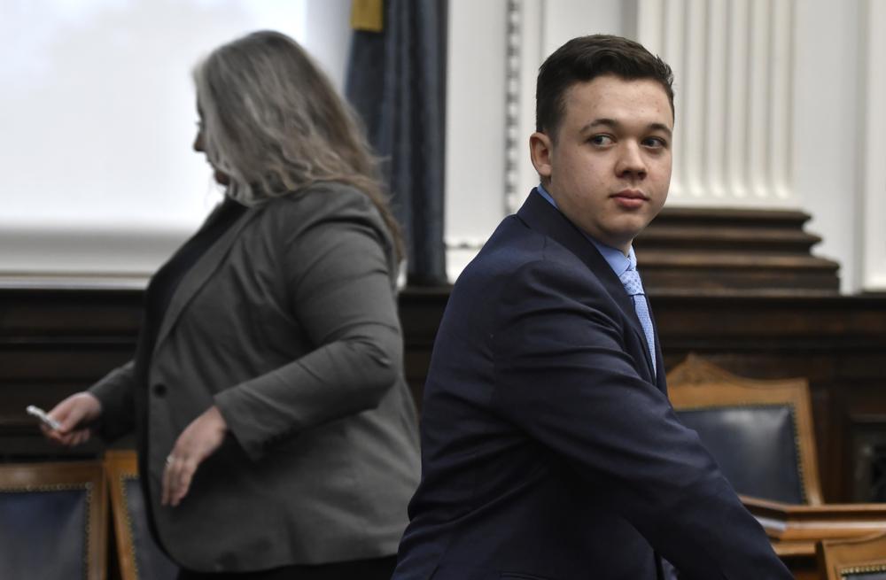 Kyle Rittenhouse, right, looks on as the jury is let out of the room during a break during his trail at the Kenosha County Courthouse in Kenosha, Wis., on Monday, Nov. 15, 2021. Rittenhouse is accused of killing two people and wounding a third during a protest over police brutality in Kenosha, last year. (Sean Krajacic/The Kenosha News via AP, Pool)