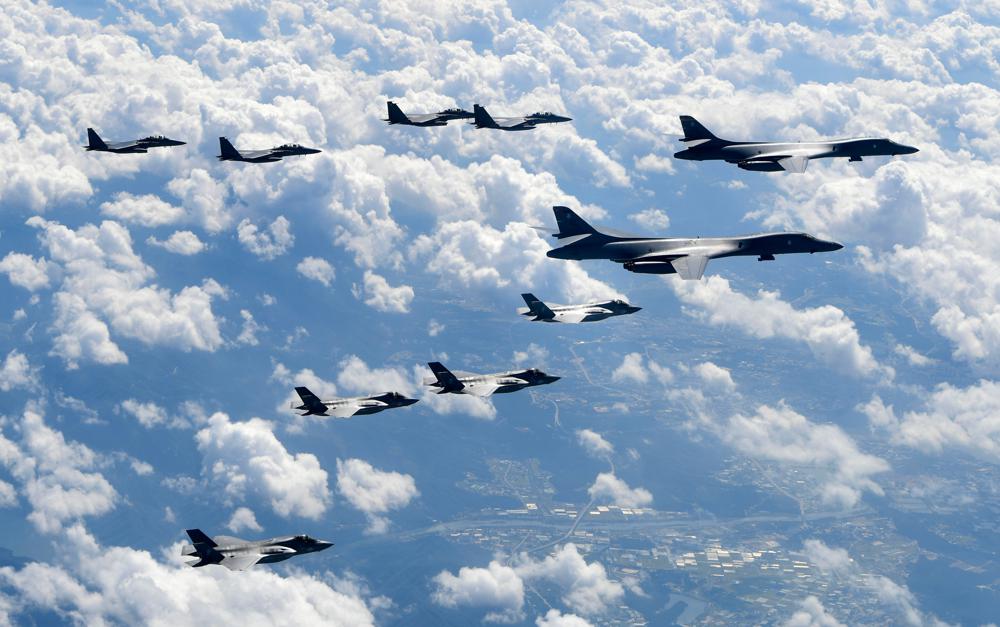 FILE - In this photo provided by South Korea Defense Ministry, U.S. Air Force B-1B bombers, F-35B stealth fighter jets and South Korean F-15K fighter jets fly over the Korean Peninsula during joint drills on Sept. 18, 2017. The United States will fly a supersonic bomber over ally South Korea as part of a massive combined aerial exercise involving hundreds of warplanes, in a show of force meant to intimidate North Korea over its barrage of ballistic missile tests this week that has escalated tensions in the region. (South Korea Defense Ministry via AP, File)