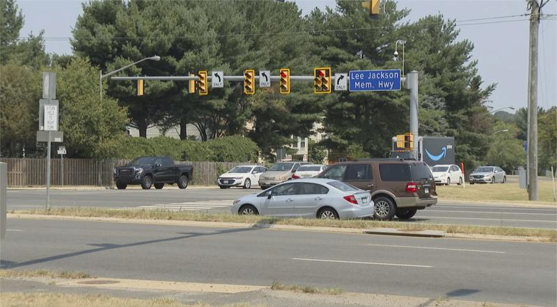 This Monday July 26, 2021 photo shows a sign for the Lee Jackson highway in Fairfax County, Va.  The names of Confederate leaders are being stripped from schools and major highways throughout Virginia. But when it comes to the many side streets in the state that carry Confederate names, it's a different story. (AP Photo/Dan Huff)