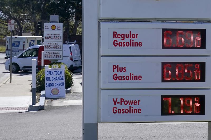 FILE - The gasoline price board is shown at a gas station in Menlo Park, Calif., March 21, 2022. A majority of Americans say they don't blame President Joe Biden for high gasoline prices, but they're giving his economic leadership low marks amid fears of inflation and deepening pessimism about economic conditions.(AP Photo/Jeff Chiu)