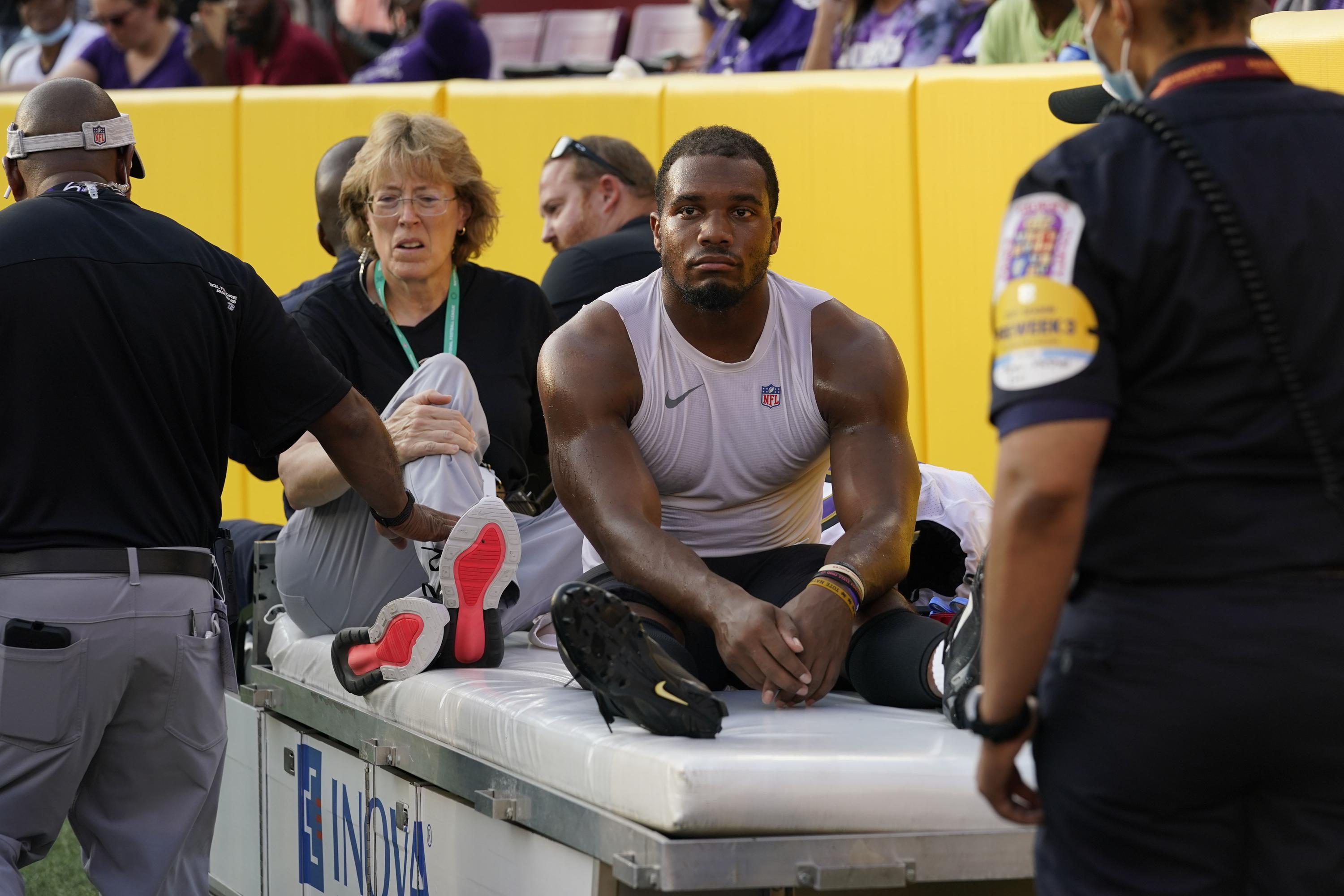 Ravens RB J.K. Dobbins to have injured left knee examined | AP News