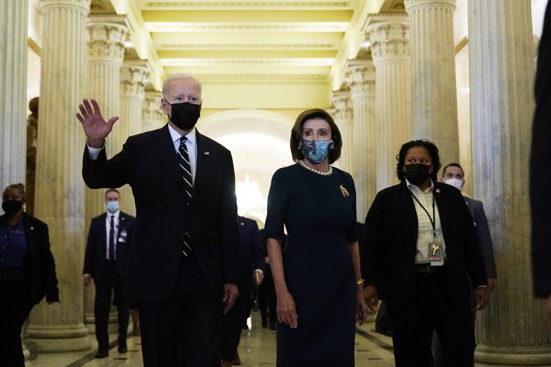 President Biden walks with House Speaker Nancy Pelosi on Capitol Hill in Washington, Thursday, Oct. 28, 2021, following a visit to meet with House Democrats. (AP Photo/Susan Walsh)