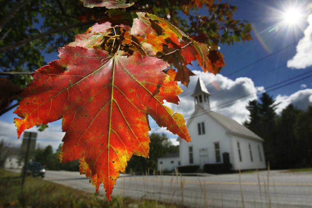 FILE - In this Sept. 17, 2010 file photo, a maple tree shows its fall colors in Woodstock, Maine. Recent leaf-peeping seasons have been disrupted by weather conditions in New England, New York and elsewhere. Arborists and ecologists say the trend is likely to continue as the planet warms. (AP Photo/Robert F. Bukaty, File)