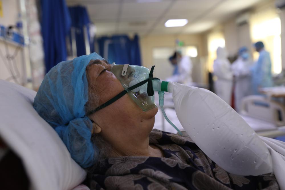 A patient is connected to oxygen tank in the intensive care unit ward for COVID-19 patients at the Afghan-Japan Communicable Disease Hospital in Kabul, Afghanistan, Sunday, May 30, 2021. Afghanistan is battling a brutal third wave of COVID infections, while health officials plead for vaccines, expressing deep frustration at the inequities of the global vaccine distribution. Positive COVID cases jump from eight percent to 60 per cent in some parts of the country. (AP Photo/Rahmat Gul)