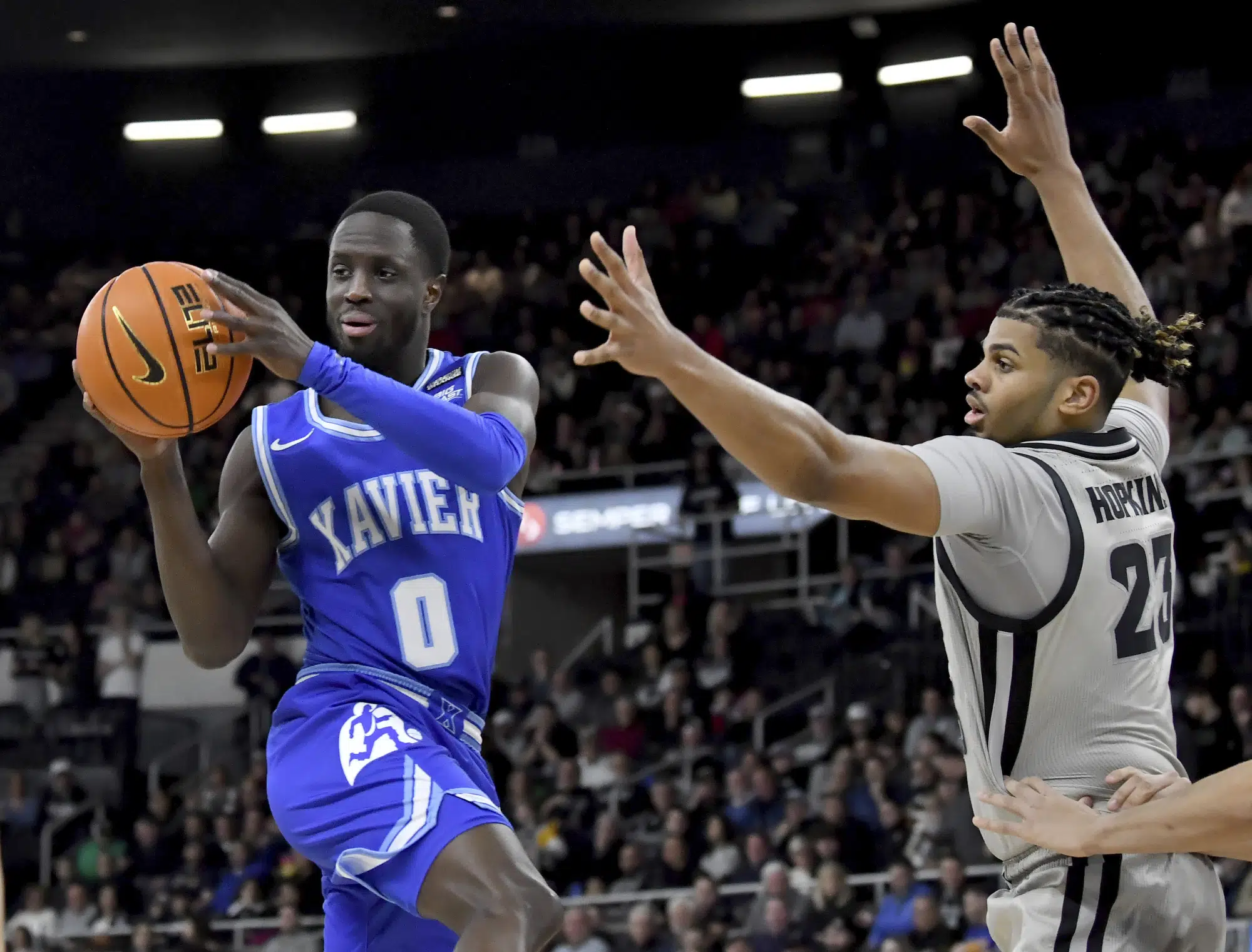 Boum goes the dynamite: Xavier guard scores 33 to beat PC | AP News