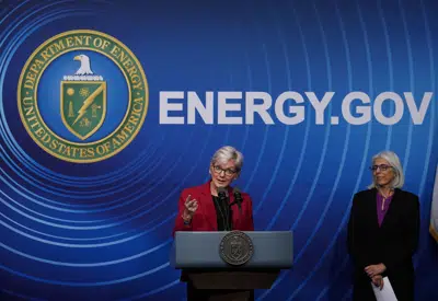 Secretary of Energy Jennifer Granholm, joined at right by Arati Prabhakar, the president's science adviser, announces a major scientific breakthrough in fusion research that was made at the Lawrence Livermore National Laboratory in California, during a news conference at the Department of Energy in Washington, Tuesday, Dec. 13, 2022. (AP Photo/J. Scott Applewhite)