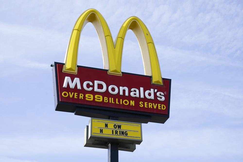 FILE - A sign is displayed outside a McDonald's restaurant, Tuesday, April 27, 2021, in Des Moines, Iowa. McDonald’s said Tuesday, March 8, 2022, it is temporarily closing all of its 850 restaurants in Russia in response to the country's invasion of Ukraine. The burger giant said it will continue paying its 62,000 employees in Russia. (AP Photo/Charlie Neibergall, File)