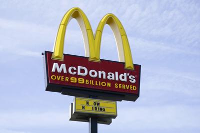 FILE - A sign is displayed outside a McDonald's restaurant, Tuesday, April 27, 2021, in Des Moines, Iowa.  McDonald’s said Tuesday, March 8, 2022,  it is temporarily closing all of its 850 restaurants in Russia in response to the country's invasion of Ukraine. The burger giant said it will continue paying its 62,000 employees in Russia.  (AP Photo/Charlie Neibergall, File)