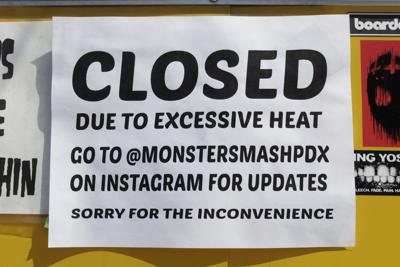 A closed sign is posted outside Rico Loverde's Monster Smash Burgers food cart in Portland, Ore., on Wednesday, July 27, 2022.  (AP Photo/Gillian Flaccus)