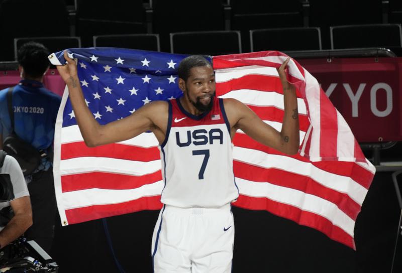United States' Kevin Durant (7) celebrates after their win in the men's basketball gold medal game against France at the 2020 Summer Olympics, Saturday, Aug. 7, 2021, in Saitama, Japan. (AP Photo/Luca Bruno)
