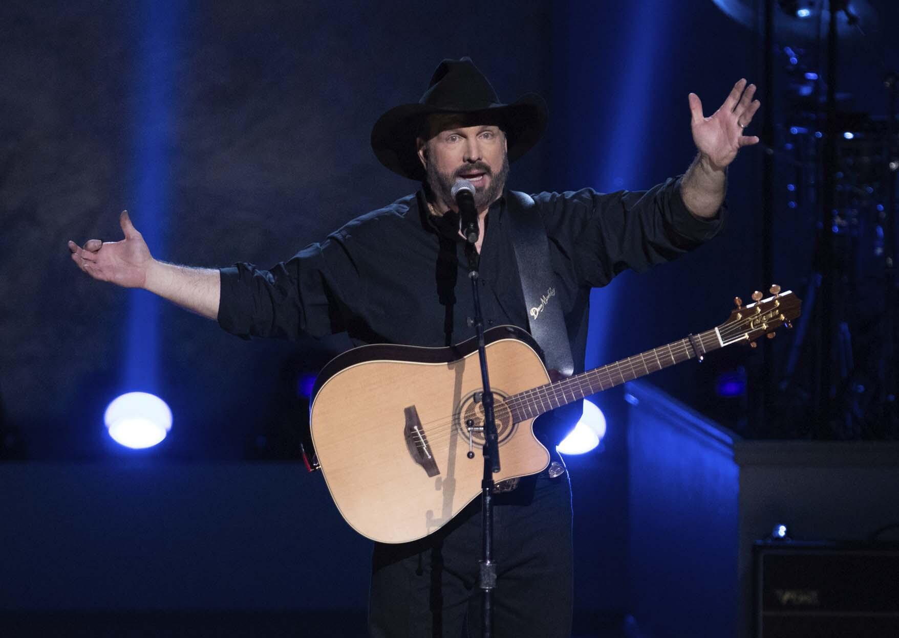 Garth Brooks cancels tour dates due to COVID surge AP News