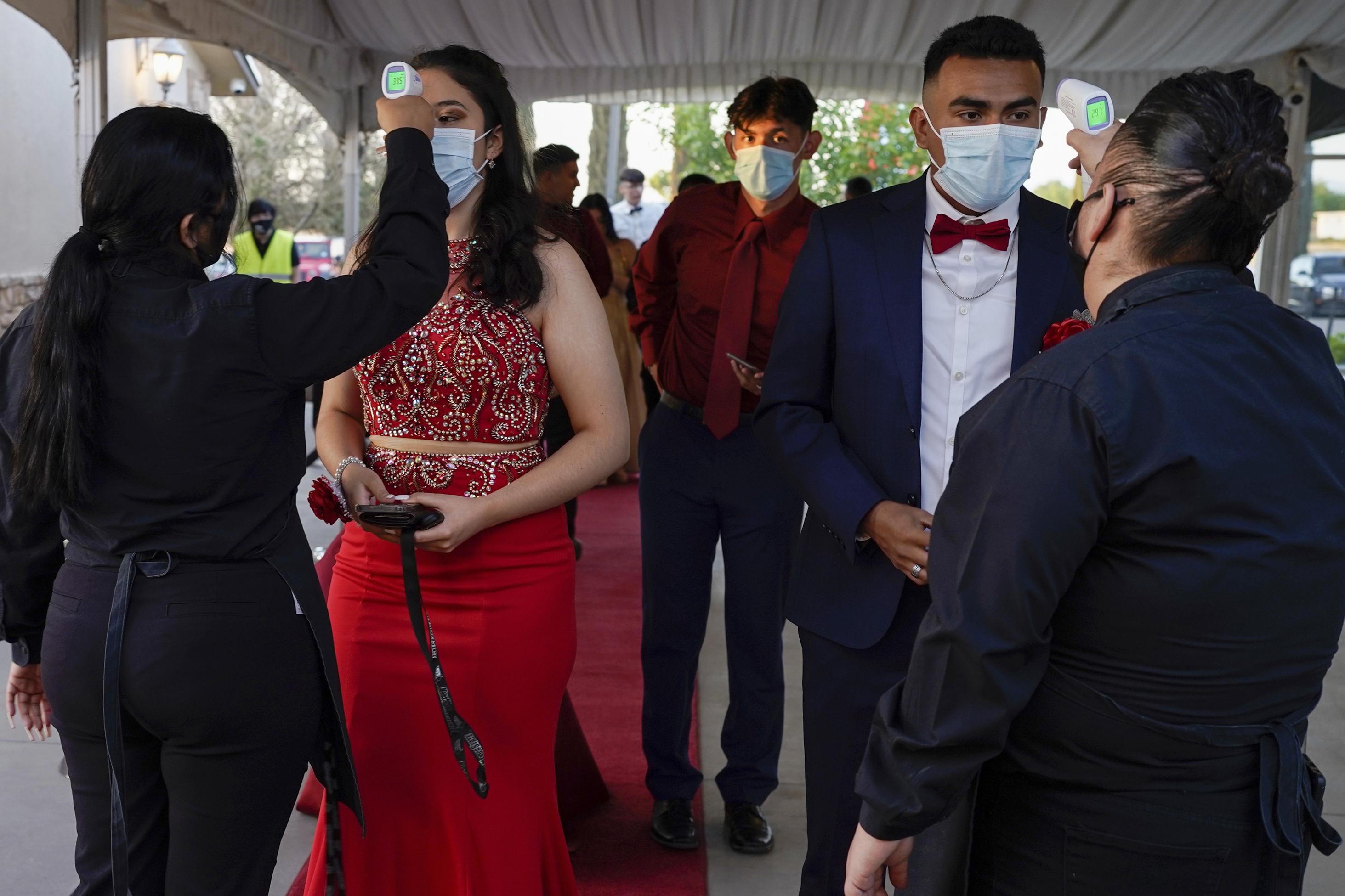 Boston teenagers pose for prom pictures after high school dance was  canceled