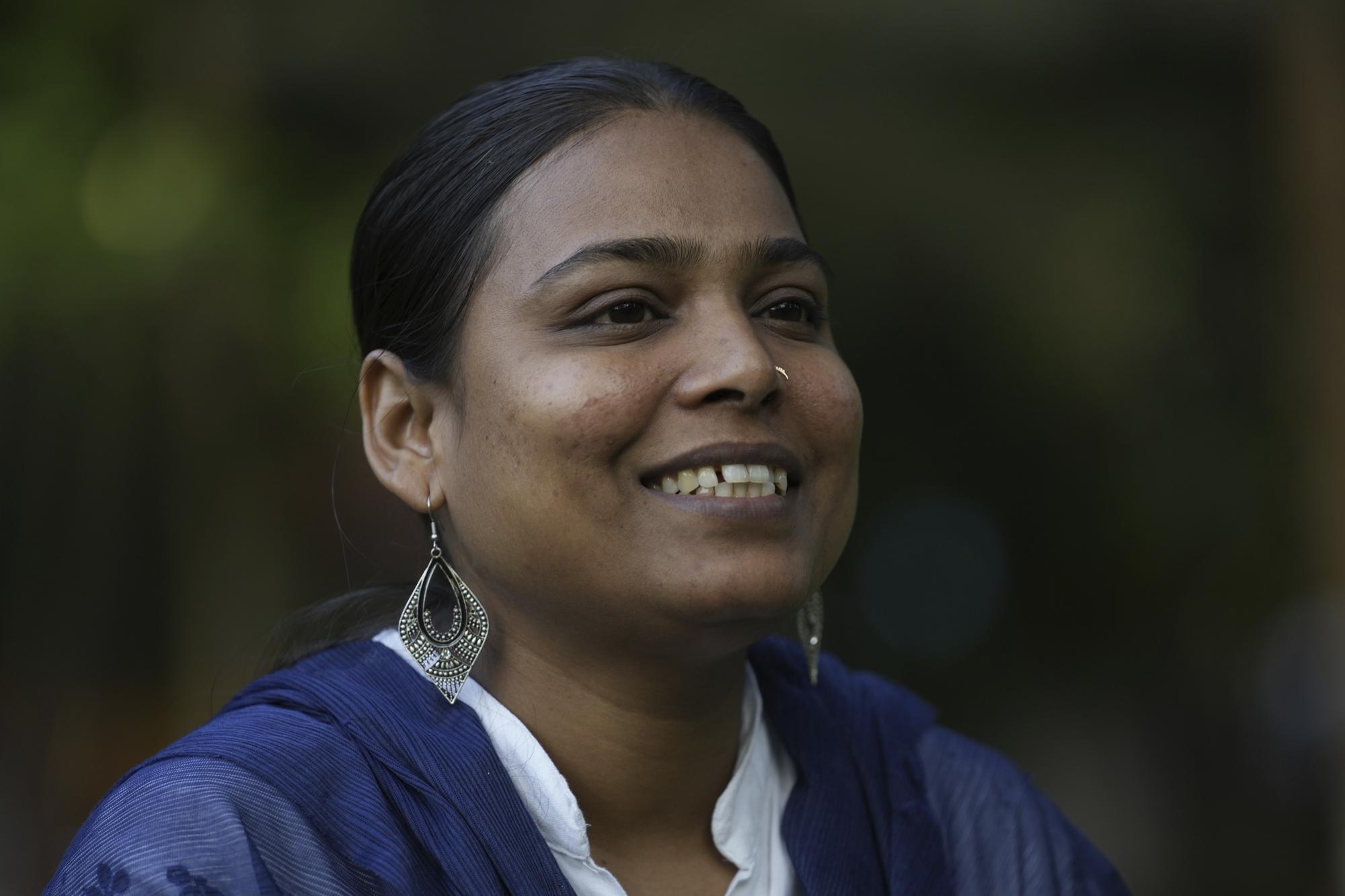 Sunita Sutar talks with a friend in Mumbai, India, Sunday, March 19, 2023. In her village of Shirsawadi in India's Maharashtra state, girls were often married off when they turned 18, but Sutar ached for a different future. She focused on school, where she topped exam after exam. Today, she lives in Mumbai, India's frenetic financial capital, where she works as an auditor for the Indian Defence Department - a government job coveted by many young Indians for its security, prestige and benefits. (AP Photo/Rajanish Kakade)