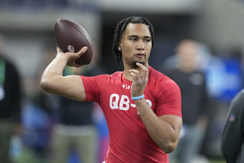 FILE - Ohio State quarterback CJ Stroud runs a drill at the NFL football scouting combine in Indianapolis, March 4, 2023. Stroud threw 85 touchdown passes to break a Big Ten record held by Drew Brees for TDs over two seasons. (AP Photo/Darron Cummings, File)