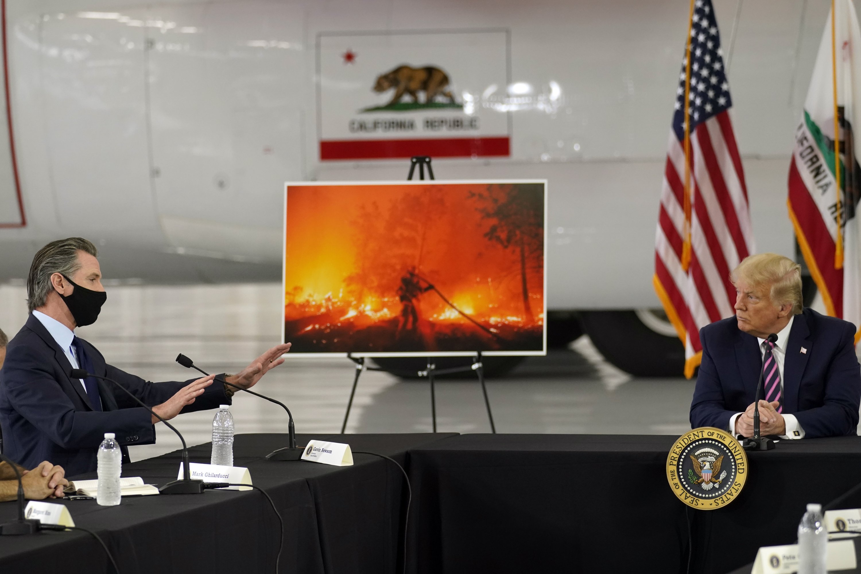 Wildfires raise fight over climate change as Trump visits - The Associated Press