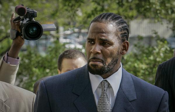 FILE - This photo from Friday May 9, 2008, shows R. Kelly arriving for the first day of jury selection in his child pornography trial at the Cook County Criminal Courthouse in Chicago. On Wednesday, Sept. 15, 2021, prosecutors in Kelly's sex trafficking trial at Brooklyn Federal Court in New York, played video and audio recordings for the jury they say back up allegations he abused women and girls. (AP Photo/Charles Rex Arbogast, File)