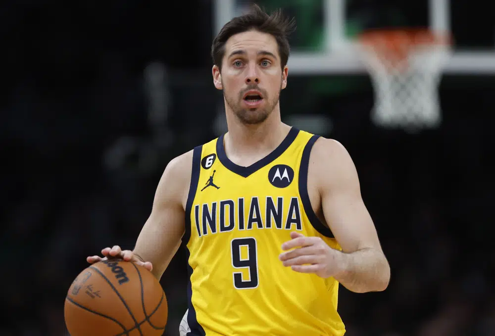 FILE - Indiana Pacers' T.J. McConnell plays against the Boston Celtics during the second half of an NBA basketball game, Friday, March 24, 2023, in Boston. The San Francisco 49ers have reached an agreement to take over English soccer club Leeds with NBA players Larry Nance Jr. and T.J. McConnell joining the ownership group as minority investors.(AP Photo/Michael Dwyer, File)