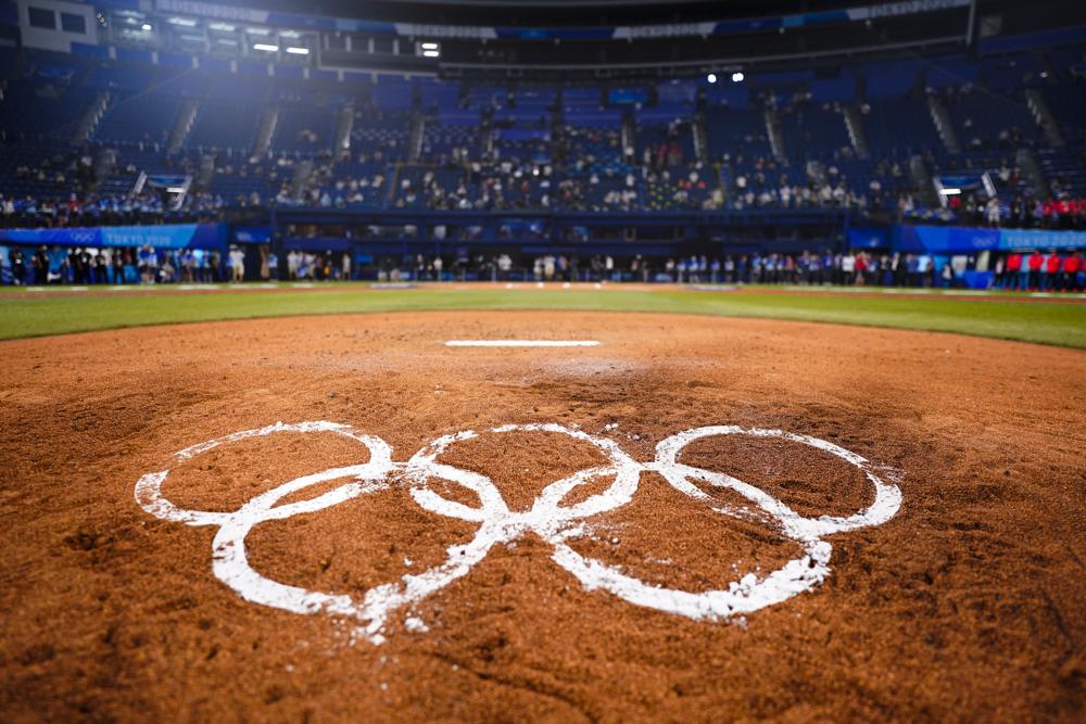 Shown are the Olympic Rings on the field after the gold medal baseball game between Japan and the United States at the 2020 Summer Olympics, Saturday, Aug. 7, 2021, in Yokohama, Japan. Japan on 2-0. (AP Photo/Matt Slocum)
