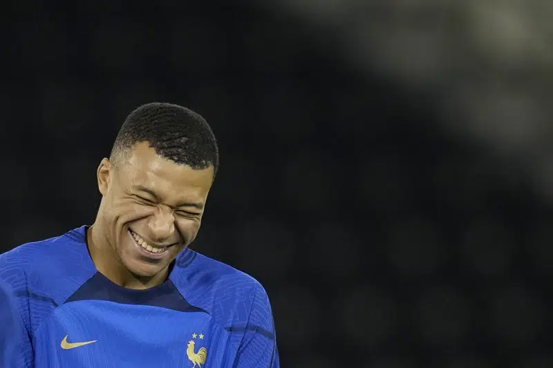 France's Kylian Mbappe jokes during a training session at the Jassim Bin Hamad stadium in Doha, Qatar, Thursday, Dec. 8, 2022. France will play against England during their World Cup quarter-final soccer match on Dec. 10. (AP Photo/Christophe Ena)