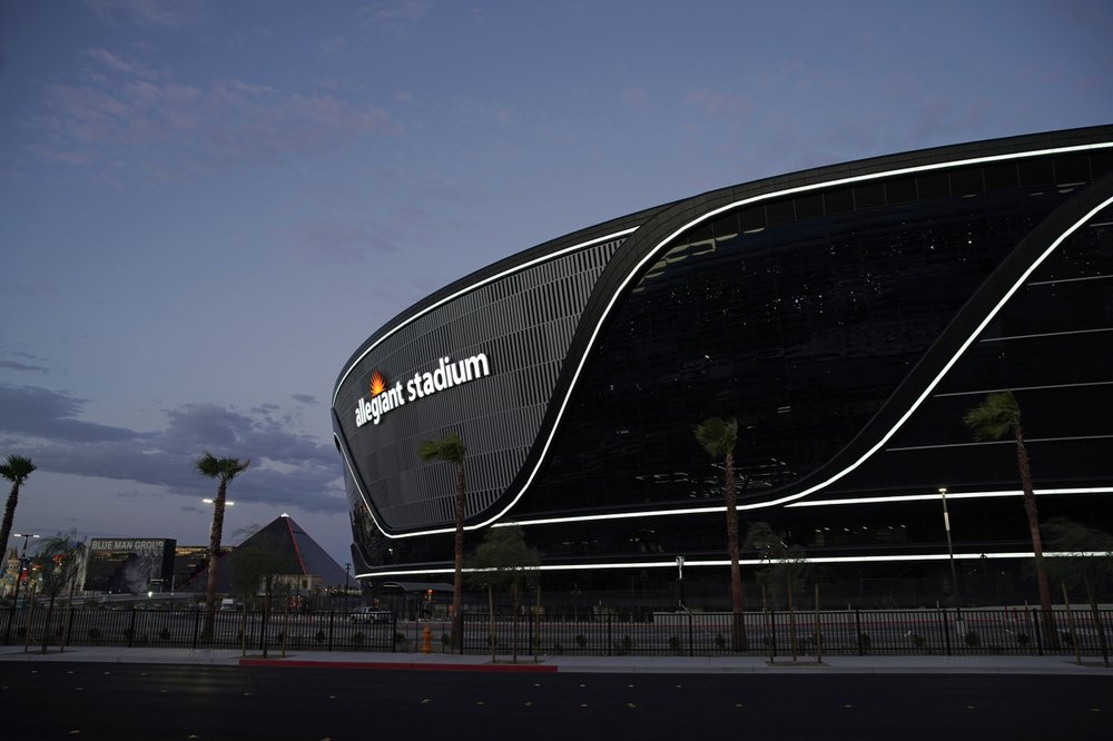 FILE - In this July 22, 2020, file photo, lights adorn Allegiant Stadium, new home of the Las Vegas Raiders football team, as it nears completion in Las Vegas. Officials in Nevada have declared "substantial completion" after nearly 1,000 days of construction of the $2 billion Allegiant Stadium in Las Vegas designed to be the home of the NFL's relocated Raiders. (AP Photo/John Locher, File)