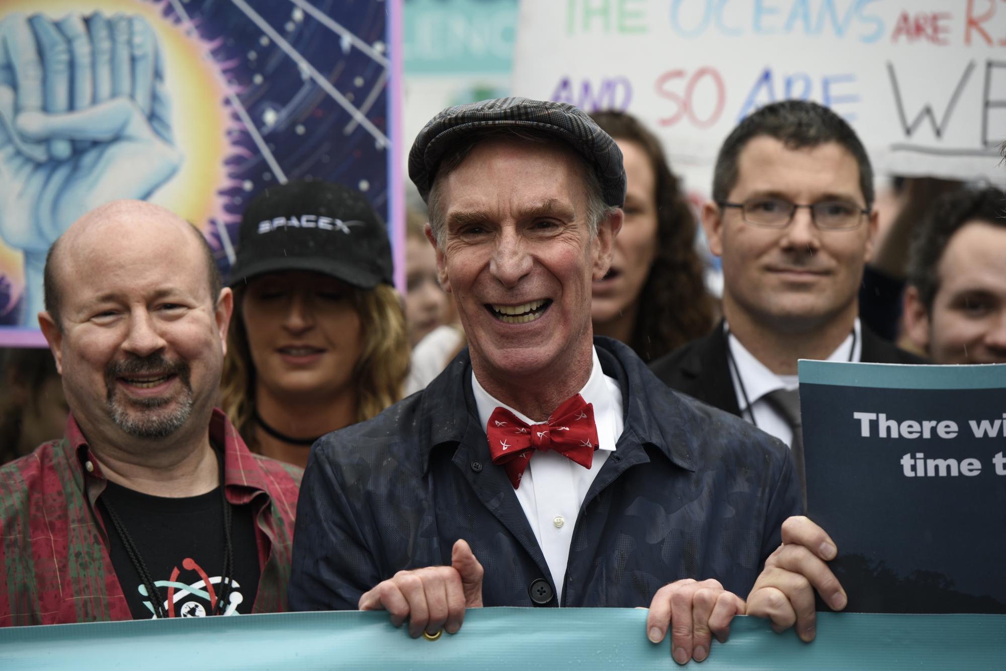 FILE - Bill Nye "The Science Guy" participates in the March for Science in Washington, April 22, 2017. "I'm so old. I was at the first Earth Day. I grew up in the city of Washington, D.C.," says engineer-turned science communicator-turned climate activist Nye, 67. (AP Photo/Sait Serkan Gurbuz, File)