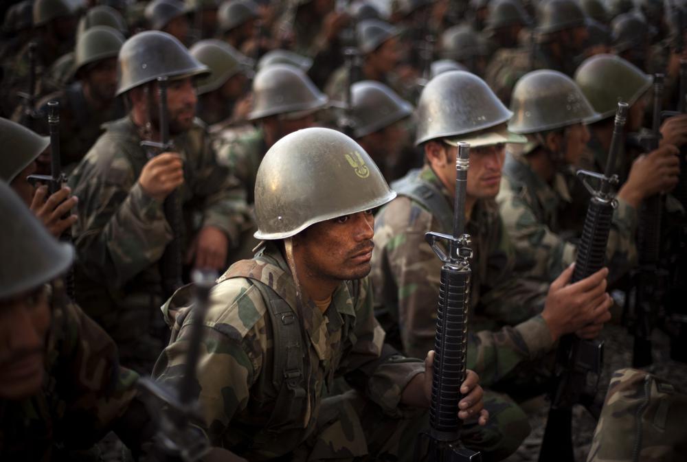 Afghan National Army recruits listen to the explanations of their instructor during a training session at the Kabul Military Training Center in Afghanistan, Sunday, July 19, 2009. (AP Photo/Emilio Morenatti)