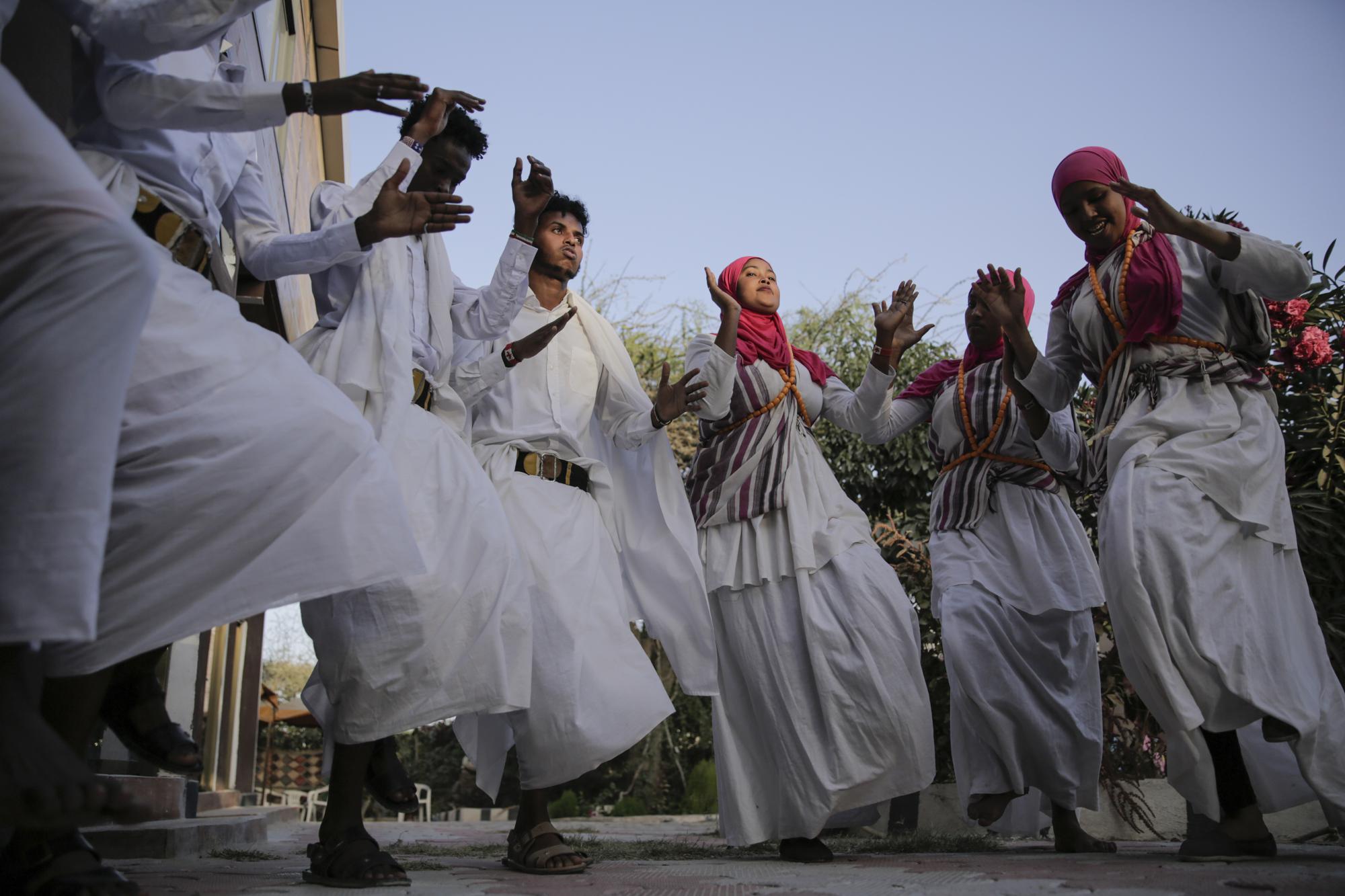 Female traditional dancers perform at a cultural center in Hargeisa, Somaliland, a semi-autonomous breakaway region of Somalia, Wednesday, Feb. 9, 2022. Officials and health workers say cases of female genital mutilation increased during the pandemic in parts of Africa and particularly in Somaliland where 98 percent of girls aged 5 to 11 undergo the procedure. (AP Photo/Brian Inganga)