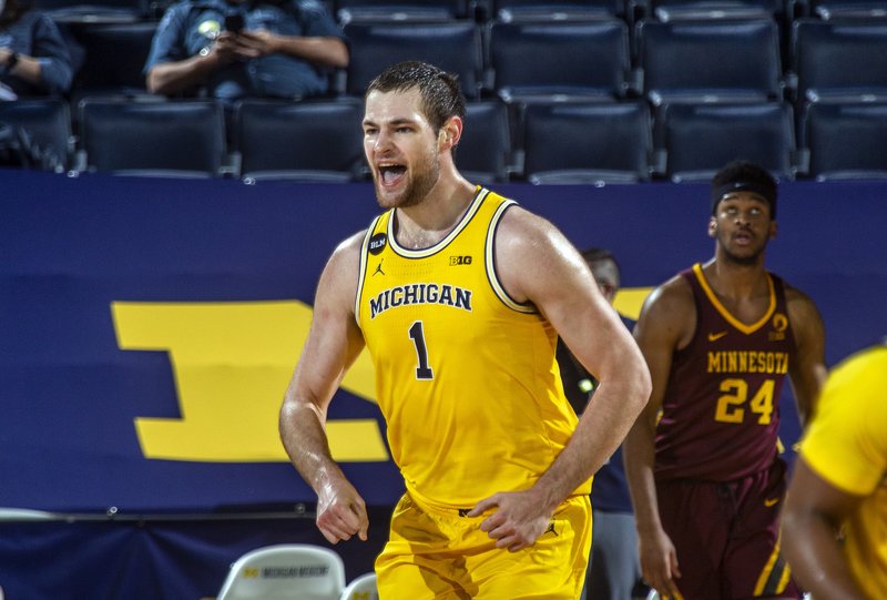 Dickinson-led No. 10 Michigan routs No. 16 Minnesota 82-57