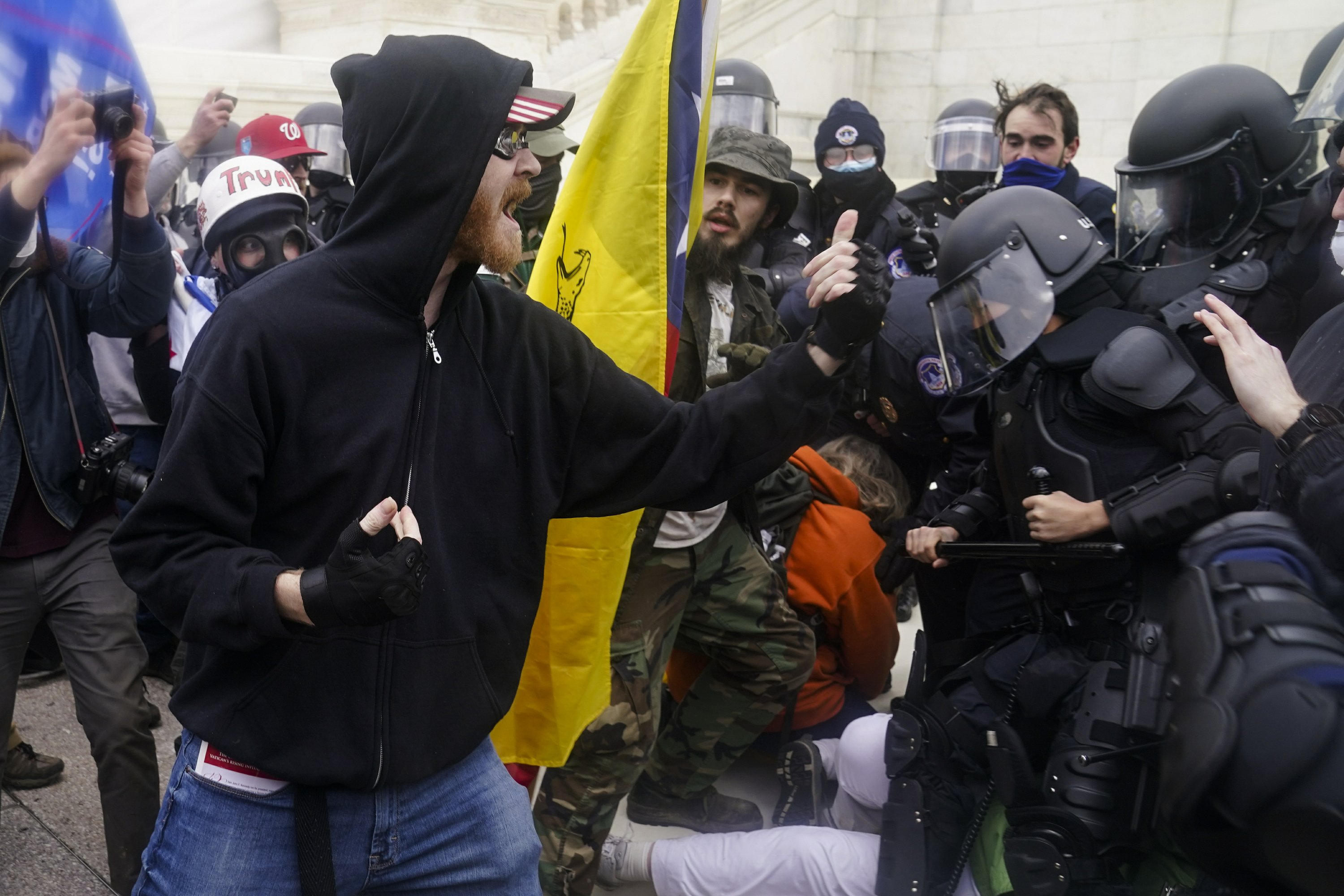 Protesters display involvement in the Capitol siege