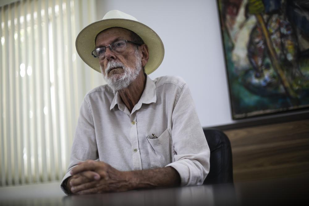 Mayor Jose Bonifacio listens during an interview in his City Hall office of Cabo Frio, Brazil, Wednesday, Dec. 15, 2021. Bonifacio acknowledges his city found itself under a spell. “The talk of the town was to know how much [bitcoin] was at, who was giving a bigger return,” he said.  (AP Photo/Bruna Prado)