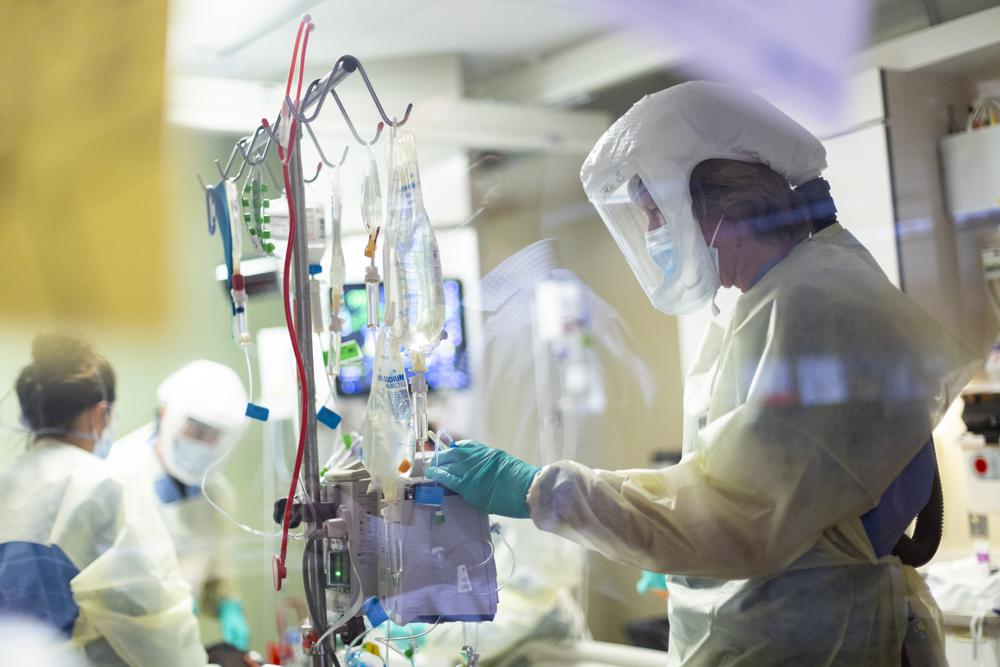 FILE - In this Aug. 31, 2021, file photo, Jack Kingsley R.N. attends to a COVID-19 patient in the Medical Intensive care unit (MICU) at St. Luke's Boise Medical Center in Boise, Idaho. Idaho public health leaders have activated crisis standards of care for the state's northern hospitals because there are more coronavirus patients than the institutions can handle. The Idaho Department of Health and Welfare made the announcement Tuesday, Sept. 7.  (AP Photo/Kyle Green, File)'s Boise Medical Center in Boise, Idaho. Idaho public health leaders have activated crisis standards of care for the state's northern hospitals because there are more coronavirus patients than the institutions can handle. The Idaho Department of Health and Welfare made the announcement Tuesday, Sept. 7.  (AP Photo/Kyle Green, File)