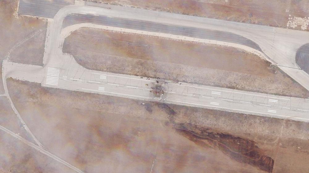 This satellite photo released by Planet Labs PBC shows the damage after an Israeli strike targeted the Aleppo International Airport, Thursday, Sept. 1, 2022. An Israeli attack targeting a Syrian airport tore a hole in the runway and also damaged a nearby piece of tarmac and structure on the military side of the airfield, satellite photos analyzed Friday by The Associated Press showed. (Planet Labs PBC via AP)