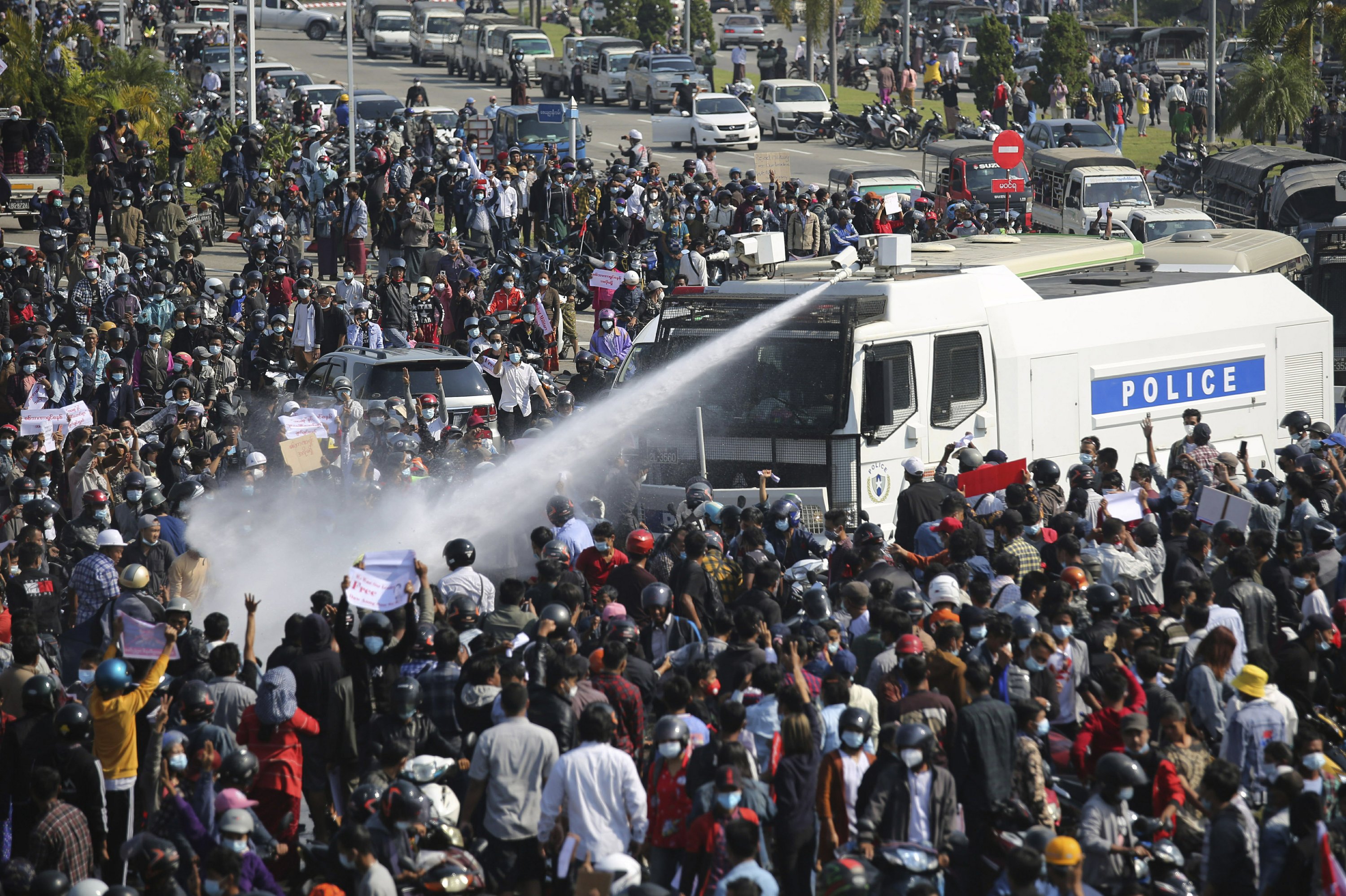 Water cannons fired at protesters as crowds increase in Myanmar