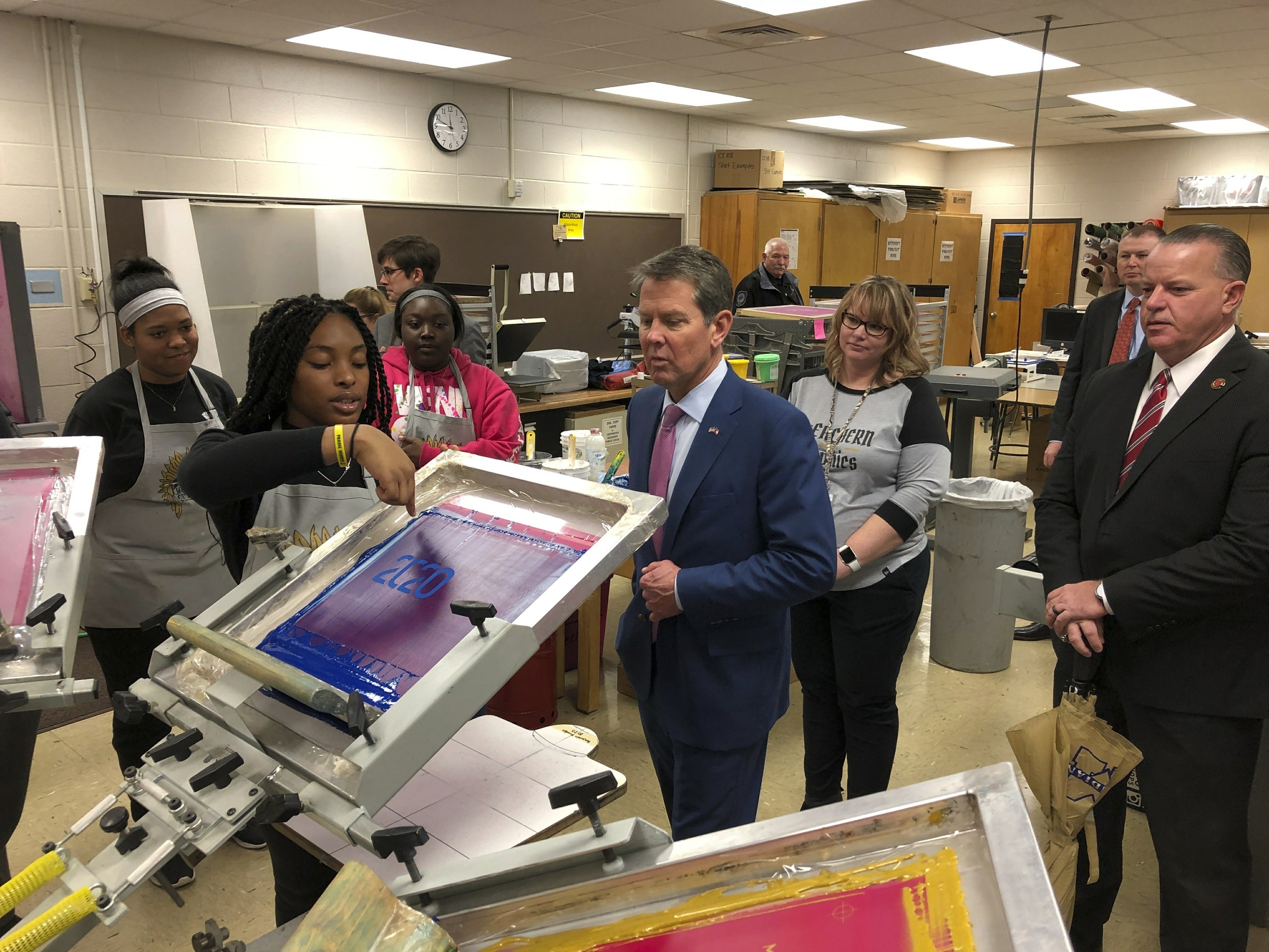 At 1 school, governor wins teacher pay raise support AP News