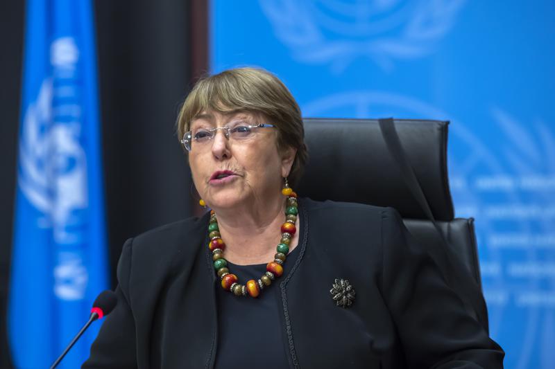 FILE - In this Wednesday, Dec. 9, 2020 file photo Michelle Bachelet, UN High Commissioner for Human Rights, speaks during a press conference at the European headquarters of the United Nations in Geneva, Switzerland. In a landmark report launched after the killing of George Floyd in the United States, Bachelet on Monday June 28, 2021, is urging countries worldwide to do more to help end discrimination, violence and systemic racism against people of African descent and “make amends” to them, including through reparations.  (Martial Trezzini/Keystone via AP, file)