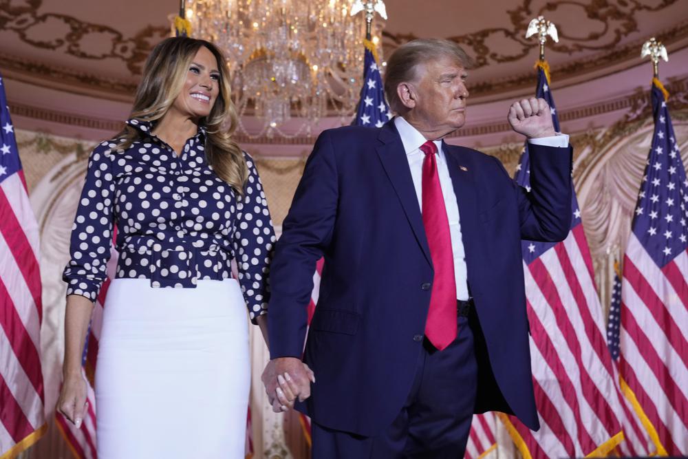 Former President Donald Trump stands on stage with former first lady Melania Trump after he announced a run for president for the third time at Mar-a-Lago in Palm Beach, Fla., Tuesday, Nov. 15, 2022. (AP Photo/Andrew Harnik)