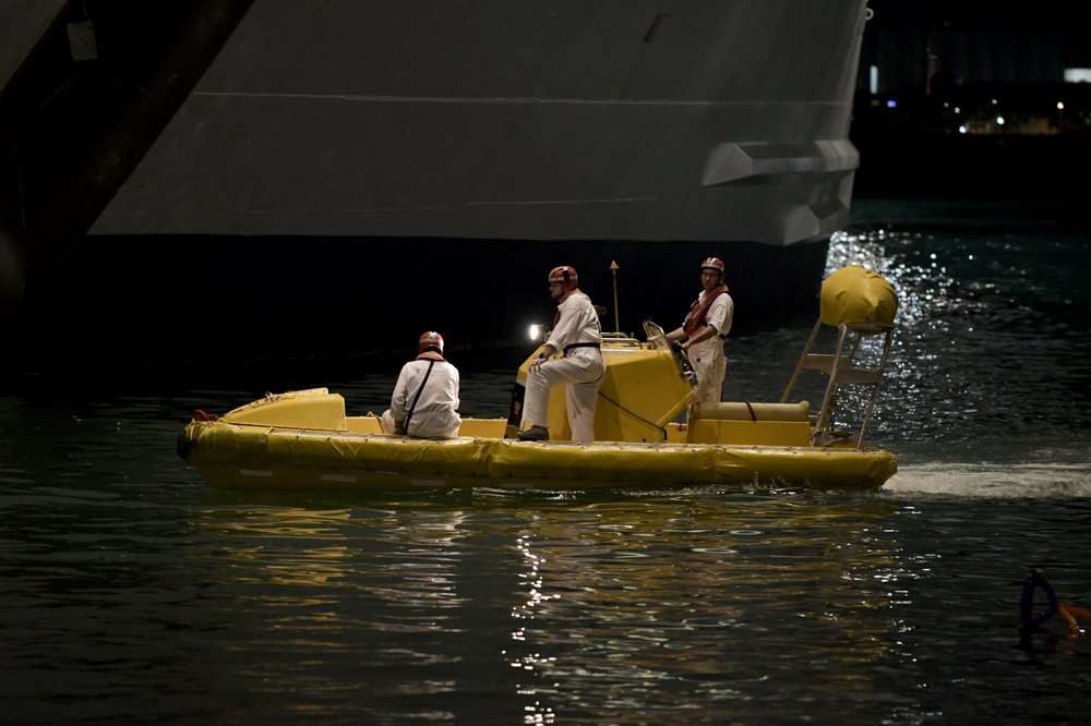 Local authorities join the U.S. Coast Guard on the search of a person who reportedly went overboard from a cruise ship just off Puerto Rico's north shore, in San Juan, Puerto Rico, Wednesday, Jan. 22, 2020. (AP Photo/Carlos Giusti)